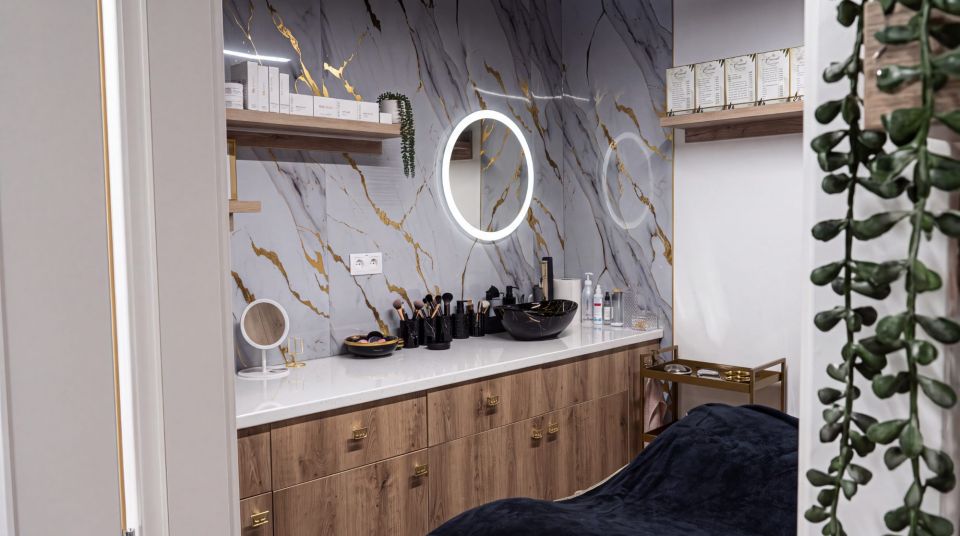 Interior of Bivi Beauty Studio in Bratislava – marble wall, illuminated mirror and treatment bed